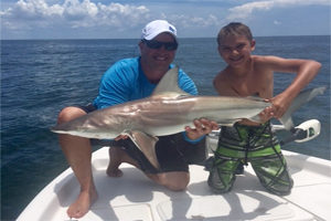 Cape Coral Fl family catching a shark